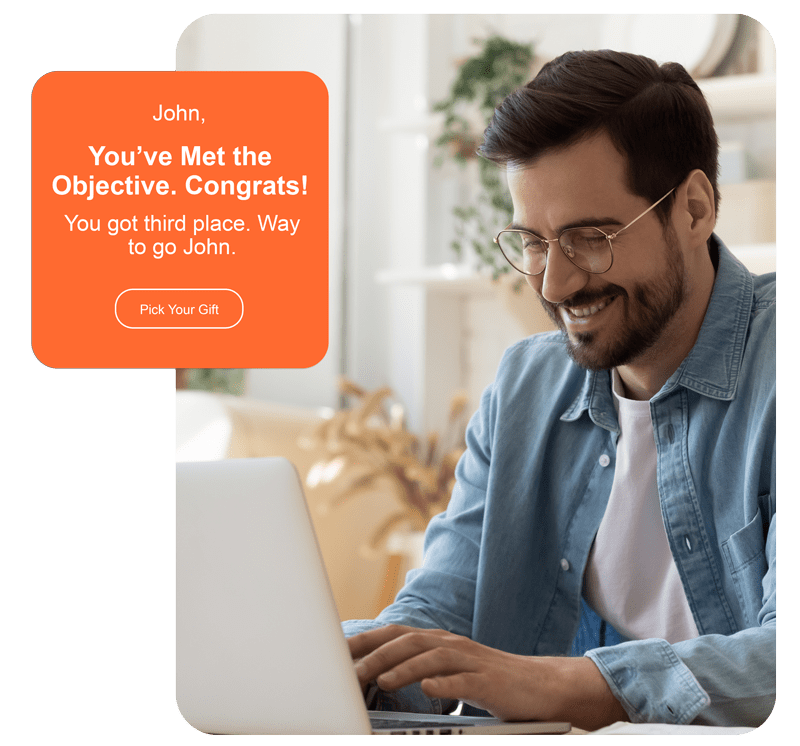 Smiling man using a laptop with a congratulatory message—perfect for peer to peer recognition solution. Smiling man using a laptop with a congratulatory message—perfect for peer to peer recognition solution.