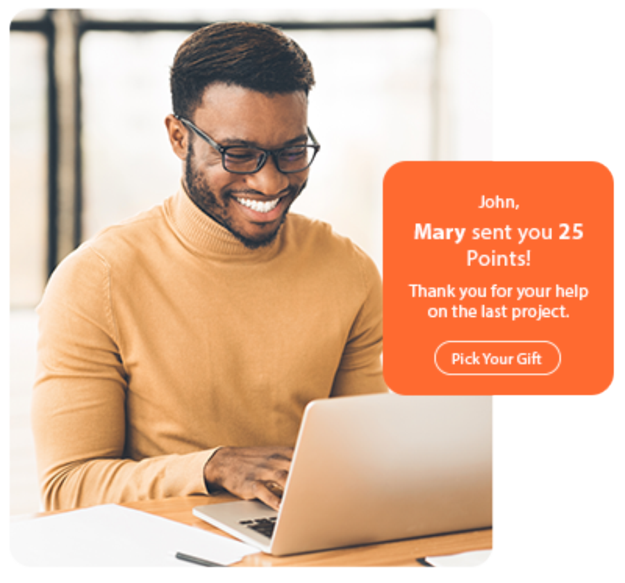 Smiling man using laptop with a message: Mary sent you 25 points! Try our event gifting solution. Smiling man using laptop with a message: Mary sent you 25 points! Try our event gifting solution.